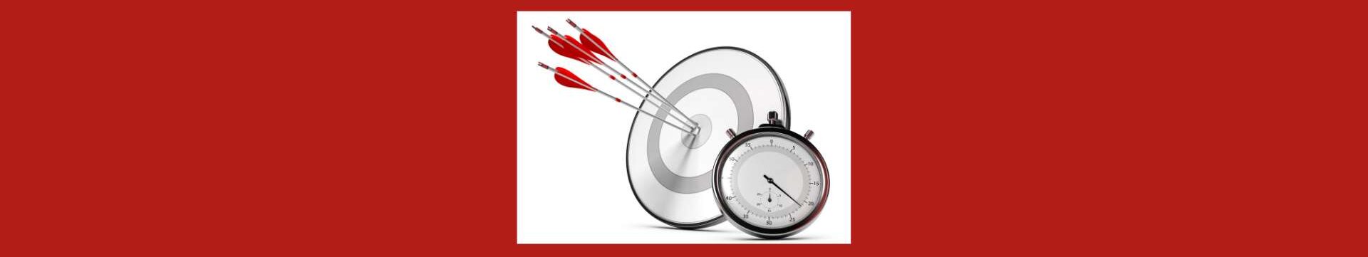 How To Set Realistic Weight Loss Goals. Red background. White square, black rimmed bulls eye, with white and gray, 4 long tip silver darts with red and silver tops. A black frame dial with white face, black marks, and black dial.