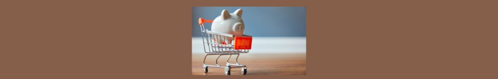 Eating Healthy On A Budget: Tips And Tricks.
Medium brown background, a squre in the center, out of focus, gray wall, with white board, and brown in the front.
A silver shopping cart with red, tag in front and red handle, a white porcelain pig in the cart.